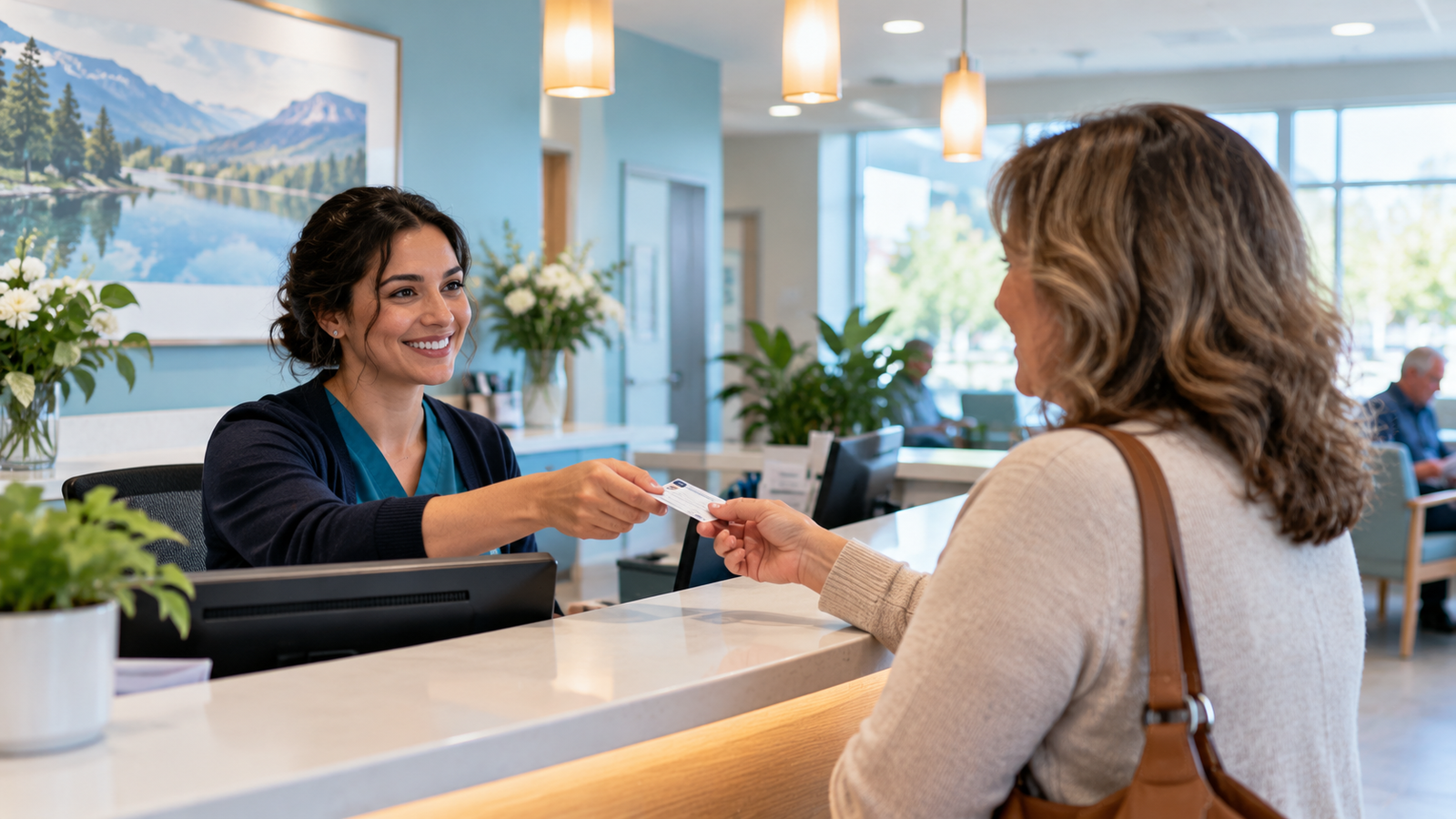 A patient checking in at the clinic reception desk